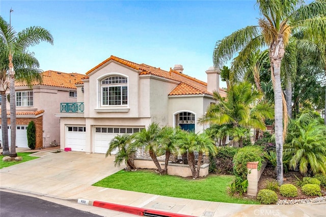 mediterranean / spanish house with a garage