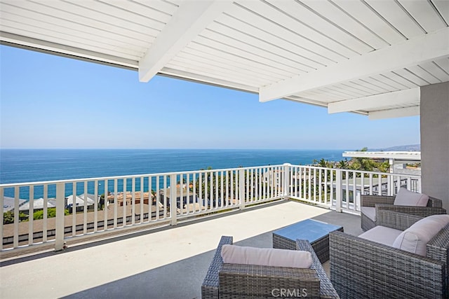 balcony with a water view and outdoor lounge area