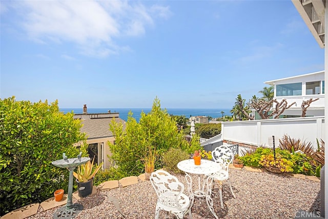 view of patio / terrace with a water view