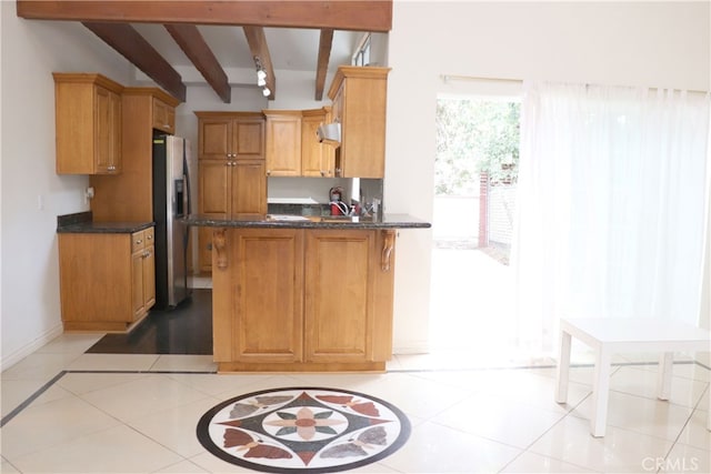 kitchen featuring beamed ceiling, kitchen peninsula, stainless steel refrigerator with ice dispenser, and light tile floors