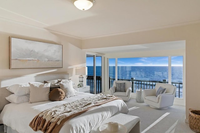 bedroom with carpet floors, ornamental molding, and a water view