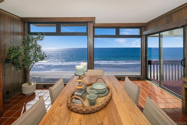 interior space featuring a water view and a beach view