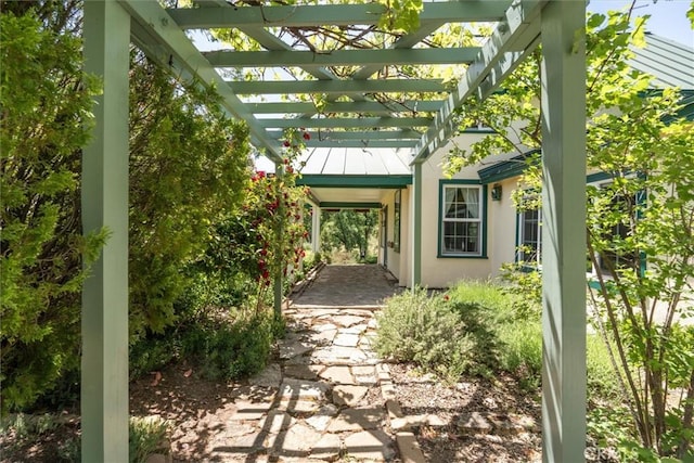 doorway to property featuring a pergola