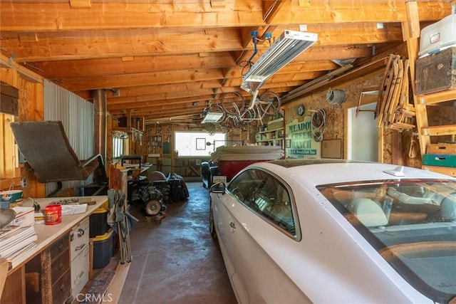 garage featuring wood walls