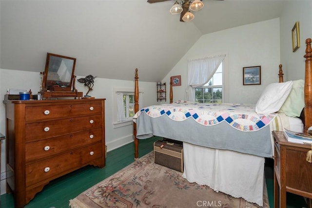 bedroom with dark hardwood / wood-style floors and lofted ceiling