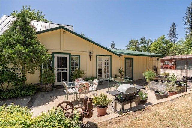 back of house with a patio area and french doors