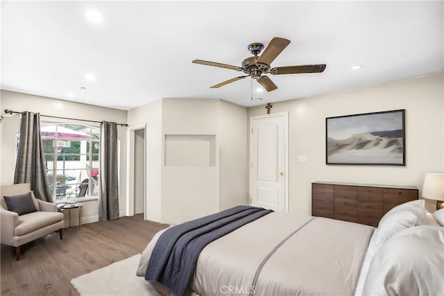 bedroom featuring ceiling fan and wood-type flooring
