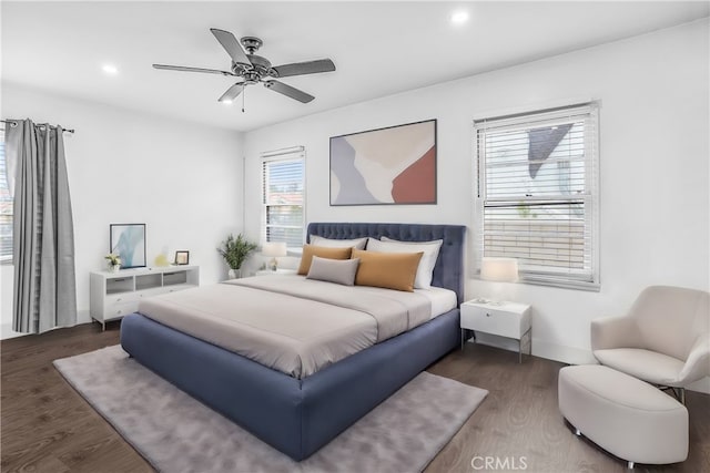 bedroom featuring ceiling fan and dark wood-type flooring