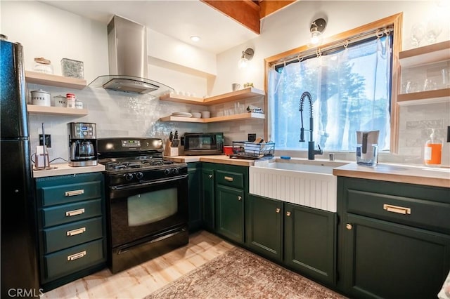 kitchen with open shelves, a sink, light countertops, range hood, and black appliances