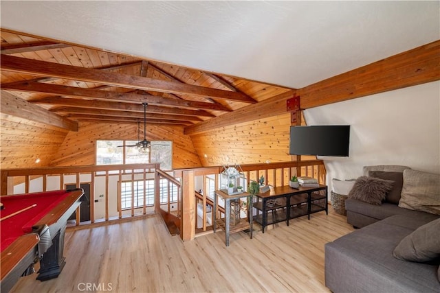 interior space with vaulted ceiling with beams, wood walls, light wood-type flooring, and billiards