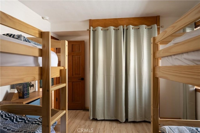 bedroom featuring light wood-style flooring