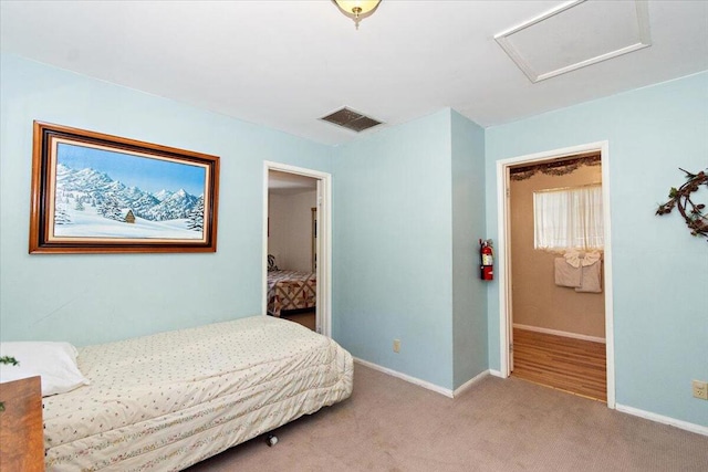 bedroom featuring light colored carpet