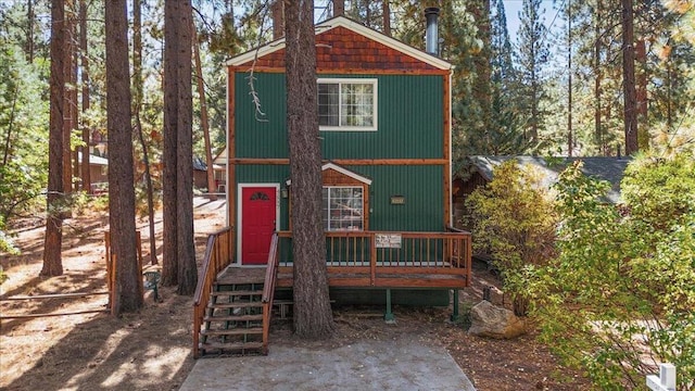 view of front of home with a wooden deck