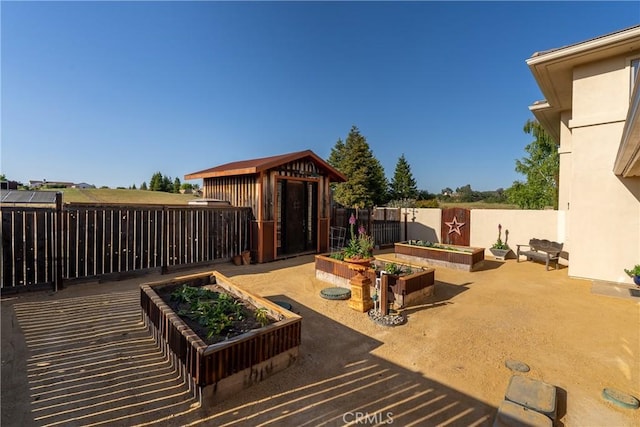 view of patio featuring a shed