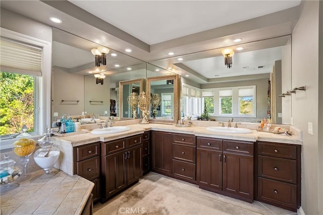 bathroom with vanity and a raised ceiling