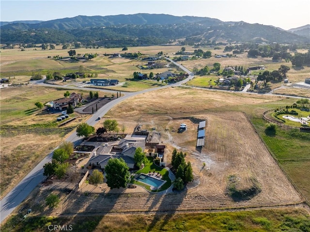 bird's eye view featuring a mountain view and a rural view