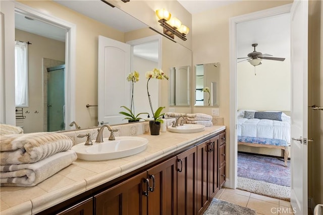 bathroom featuring an enclosed shower, vanity, tile patterned floors, and ceiling fan