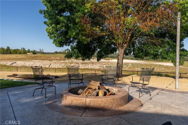 view of patio featuring a fire pit