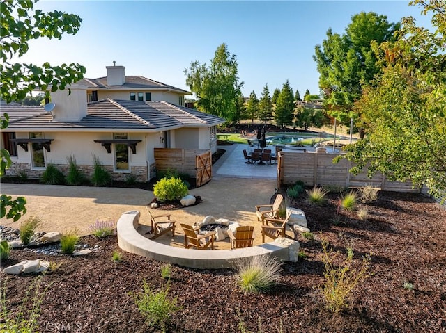 exterior space featuring a fire pit and a patio area