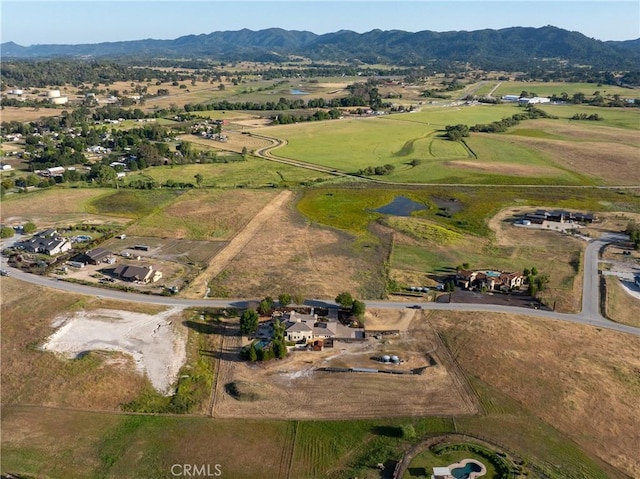 aerial view featuring a mountain view and a rural view