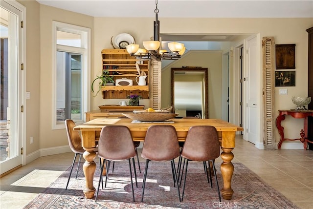 dining area with light tile patterned floors, plenty of natural light, and a notable chandelier