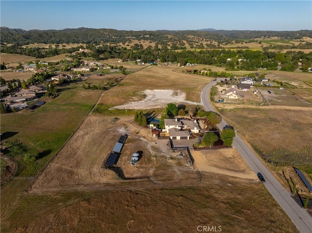 birds eye view of property with a rural view