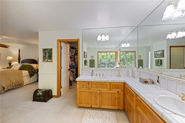 bathroom with decorative backsplash and vanity