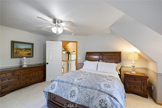 bedroom with ceiling fan and light carpet