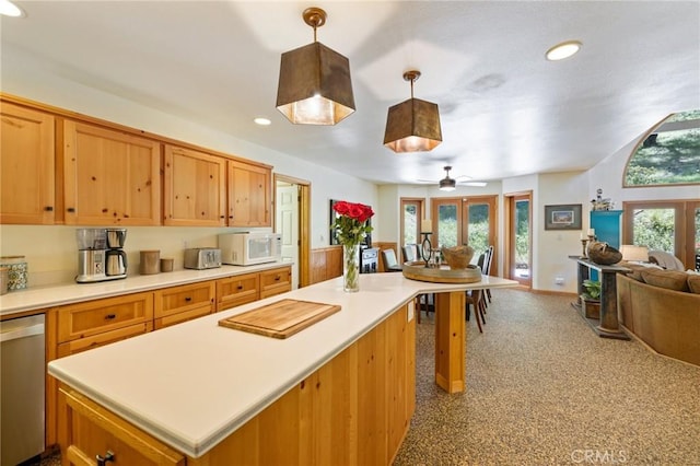 kitchen featuring decorative light fixtures, french doors, ceiling fan, light colored carpet, and stainless steel dishwasher