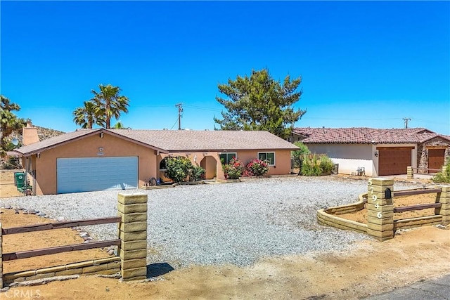 single story home with a garage