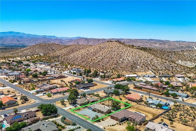 drone / aerial view featuring a mountain view