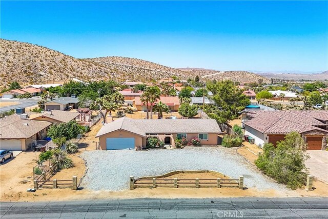 birds eye view of property with a mountain view