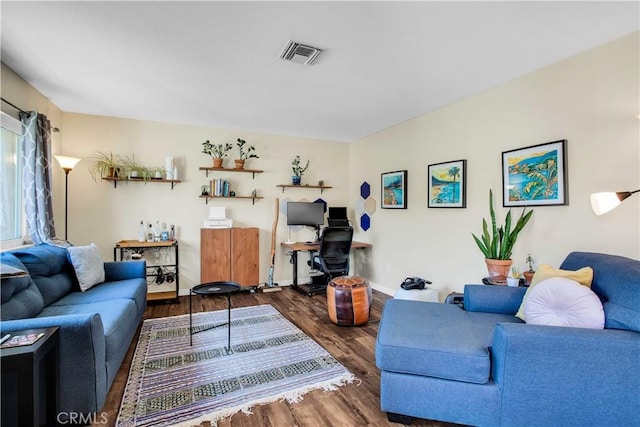 living room featuring dark wood-type flooring