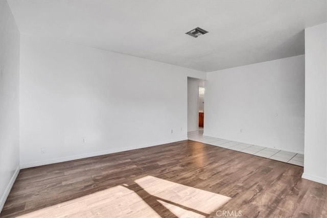 spare room featuring hardwood / wood-style flooring