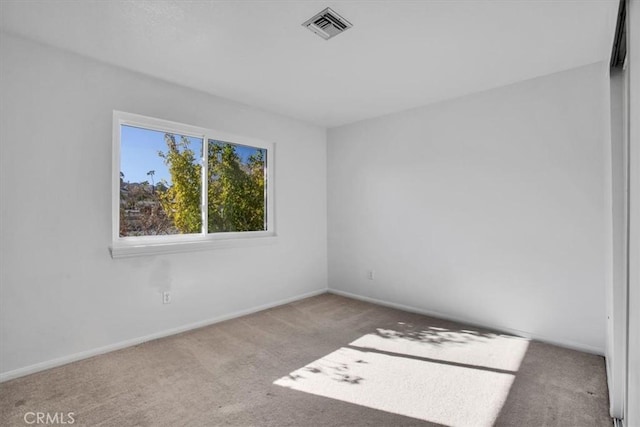 view of carpeted spare room