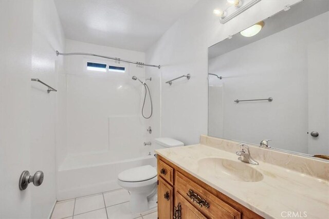 full bathroom with toilet, tile patterned flooring, washtub / shower combination, and vanity