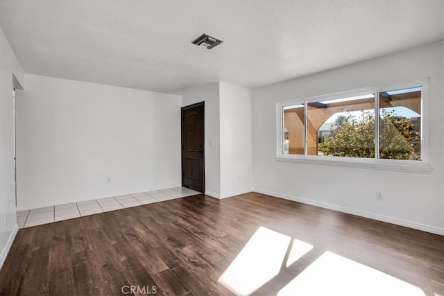 unfurnished room with light hardwood / wood-style flooring