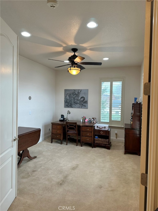 office with ceiling fan and carpet floors