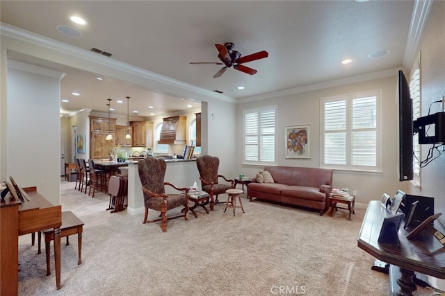 carpeted living room with ornamental molding and ceiling fan