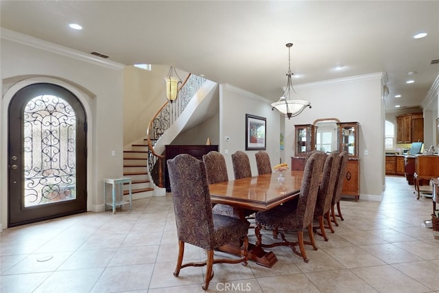 tiled dining space with crown molding