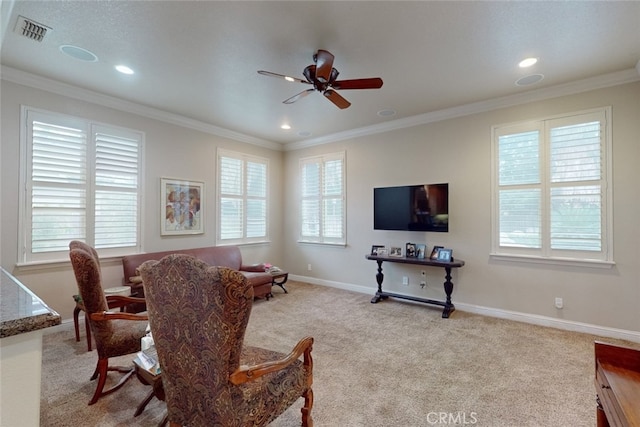 dining room featuring light colored carpet, ceiling fan, and crown molding