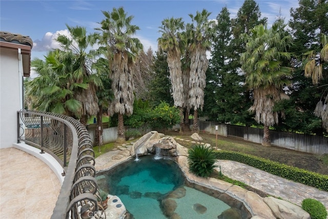 view of swimming pool featuring pool water feature