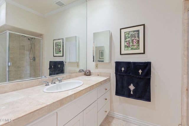 bathroom featuring vanity, ornamental molding, and an enclosed shower