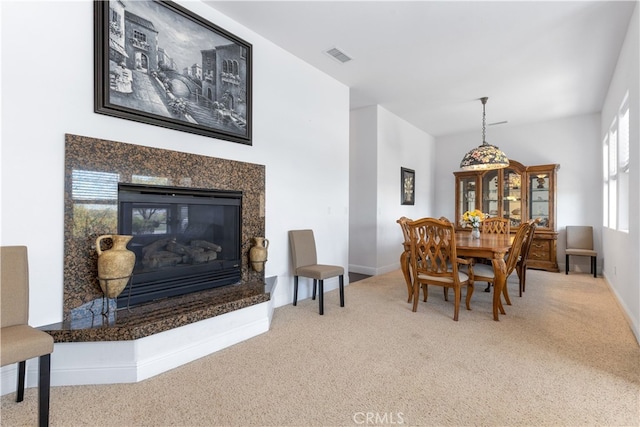 dining room with light carpet