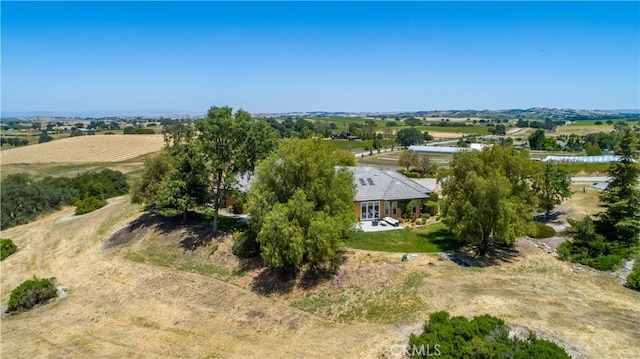 birds eye view of property with a rural view