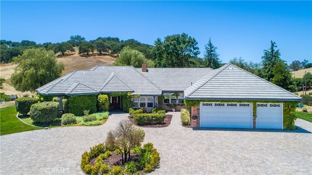 ranch-style house featuring a garage