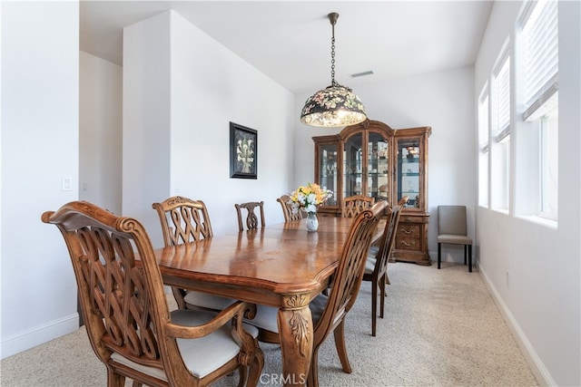 dining area with light carpet