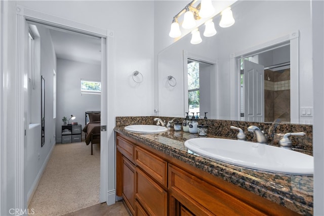 bathroom with dual sinks and vanity with extensive cabinet space