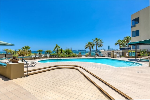 view of swimming pool with a patio area