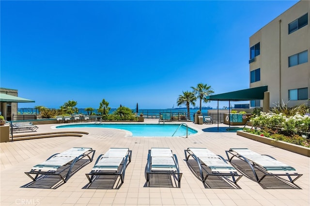 view of swimming pool featuring a patio